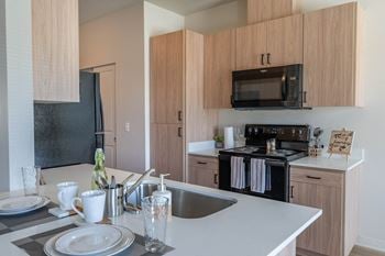 Kitchen with black fridge